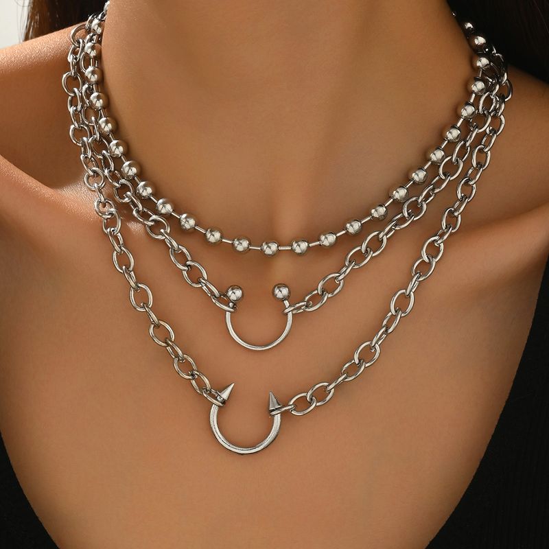 Collana con ciondolo all'ingrosso, gioielli europei e americani, tendenza hip hop, personalità di nicchia, stile punk, design multistrato, collana_voghion.com