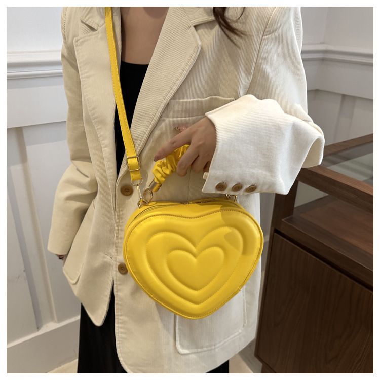 Indentatura semplice a forma di cuore carina tinta unita femminile cuore shopping moda plissettata borsa a tracolla_voghion.com