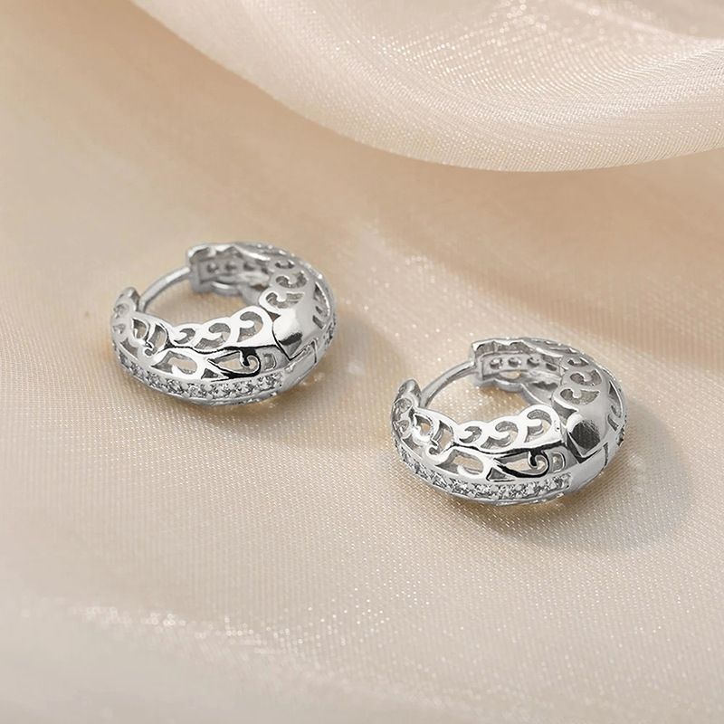 Cao Shi's hot selling with hollow out design, floral micro inlaid ear buttons, textured circles, geometric earrings_voghion.com
