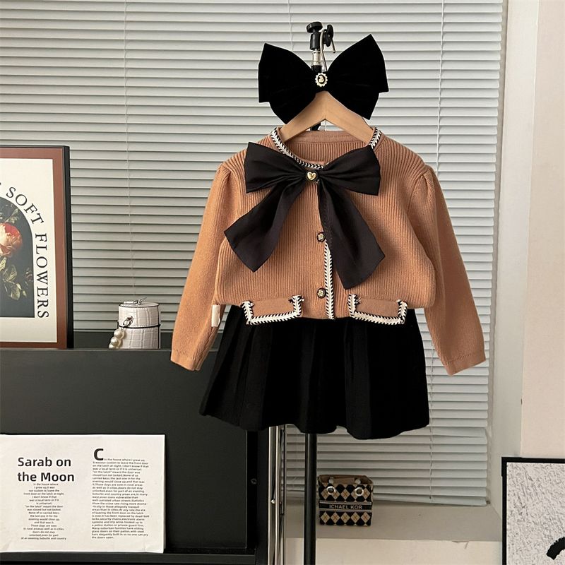 Vestito in maglia per ragazze autunno e inverno, versione coreana, con fiocco in maglia e maniche a sbuffo_voghion.com
