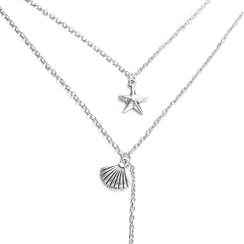 Gioielli di tendenza, stelle marine, capesante, coda di pesce, collana multistrato, catena corta per clavicola_voghion.com
