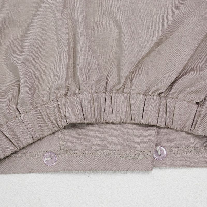 Completo da donna per il pendolarismo: camicetta con ampio risvolto e pantaloni con maniche a pieghe_voghion.com