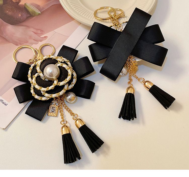 Κορεάτικη μόδα μικρό άρωμα δερμάτινη ταινία καμέλια φούντα μπρελόκ μπουκάλι άρωμα μαργαριτάρι τσάντα κρεμαστό δώρο Πρωτοχρονιάς_voghion.com