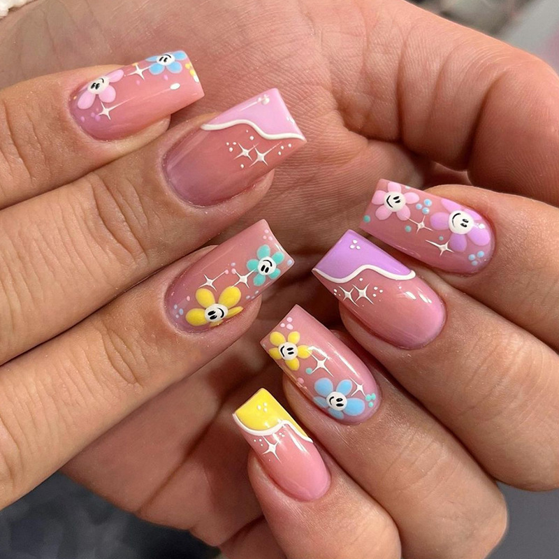 Mid length fake nails, shiny small flowers, cute playful, fresh and natural nail art pieces, finished in pairs_voghion.com