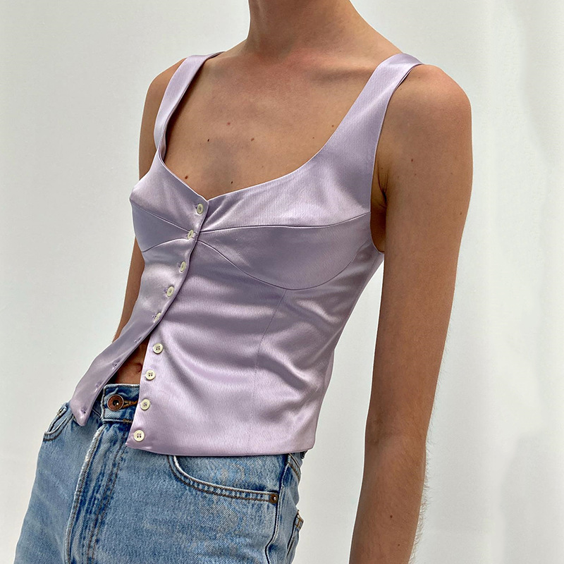 La camicetta da donna con colletto quadrato, cavezza, bottoni, senza maniche, senza schienale, può essere coperta con un gilet_voghion.com