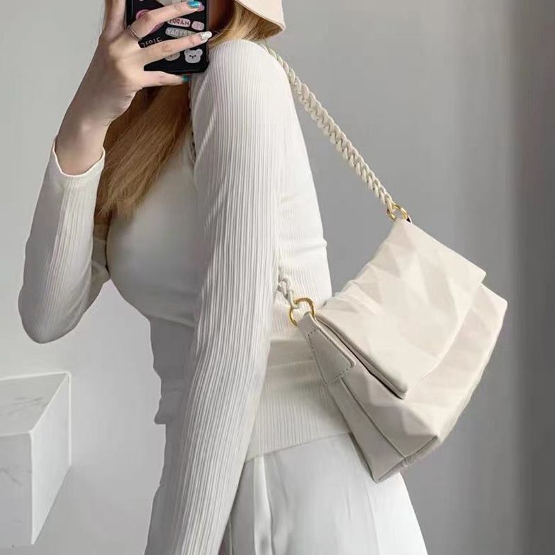 2025 Nova Bolsa Crossbody Feminina Niche Design Fashion Versátil Alça de Corrente Ombro Único Couro Genuíno Axilas de Alta Qualidade_voghion.com