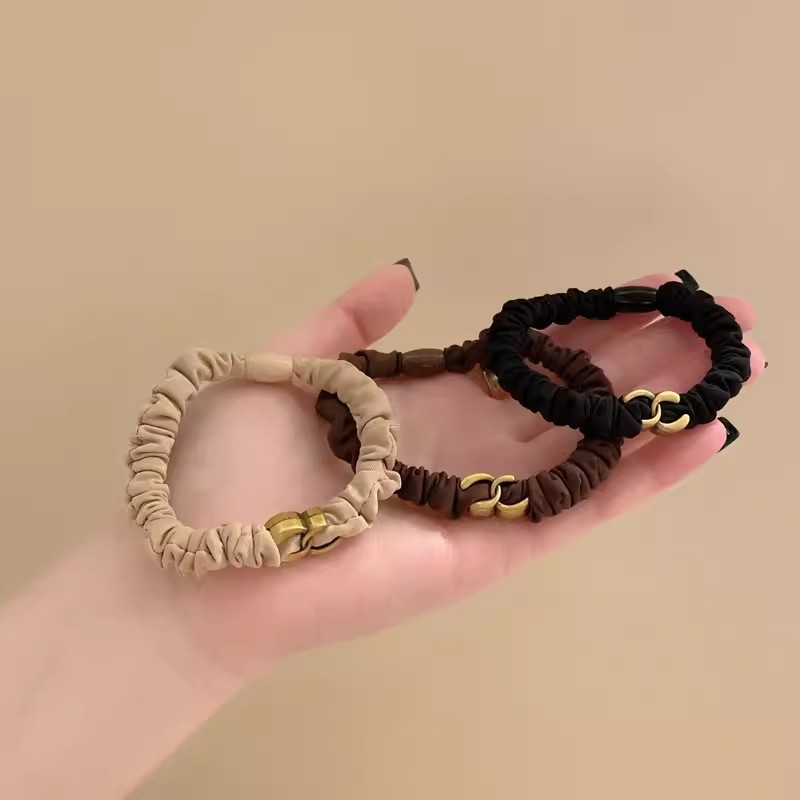 Un anello per capelli di base di nicchia e di fascia alta con versatili elastici neri, anelli per l'intestino tenue, elevata elasticità, nessun danno_voghion.com