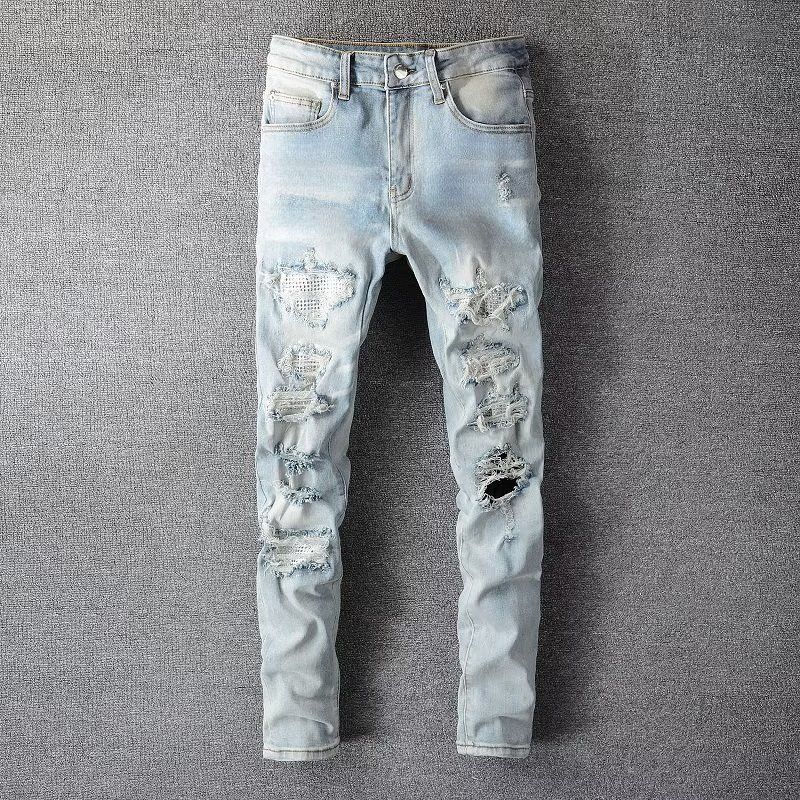 High Street Chiu brandneue, nachgewaschene Messerschnittlöcher in der Bettleraufkleber-elastischen Slim-Fit-Jeans des Mannes_voghion.com