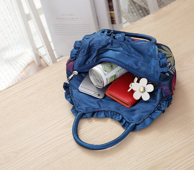 Mittelgroße neue Schlüsseltasche für Damen, koreanische Version der Damenhandtasche, einfarbige Damenhandtasche mit Reißverschluss aus Spitze._voghion.com