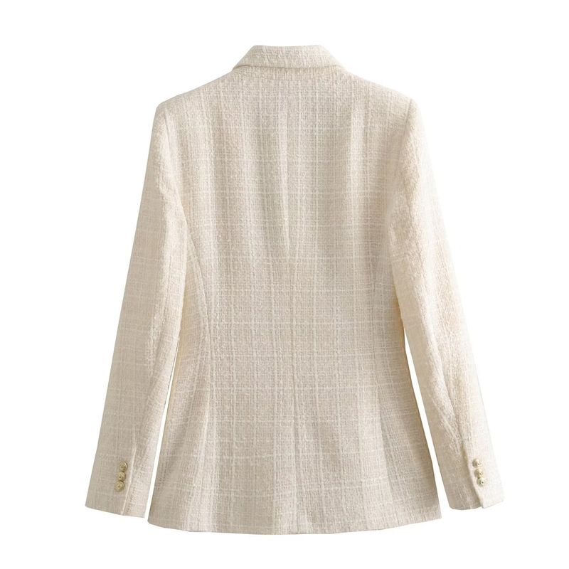 Damjacka med lös kostym med textur och mode_voghion.com