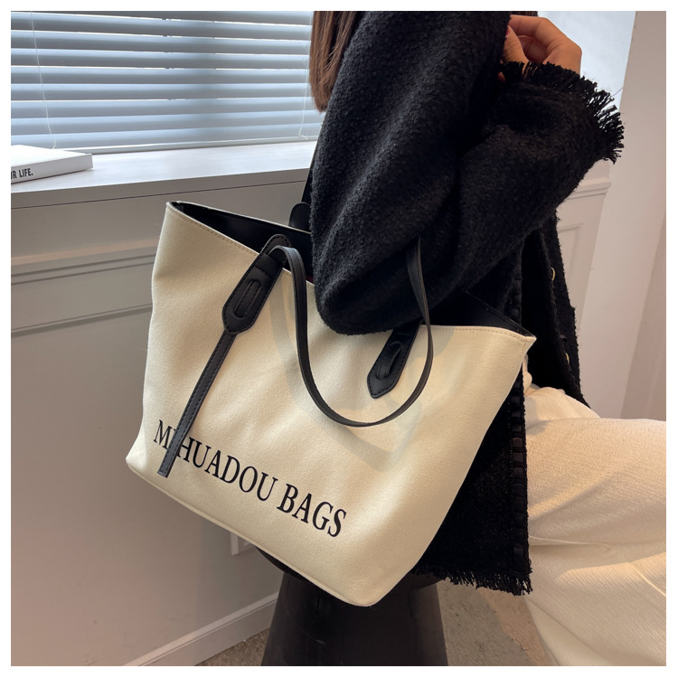 Canvas Große Damen 2023 Neue Mode Pendler Umhängetasche Einfarbig Brief Stil Urban Einfache Einkaufstasche_voghion.com