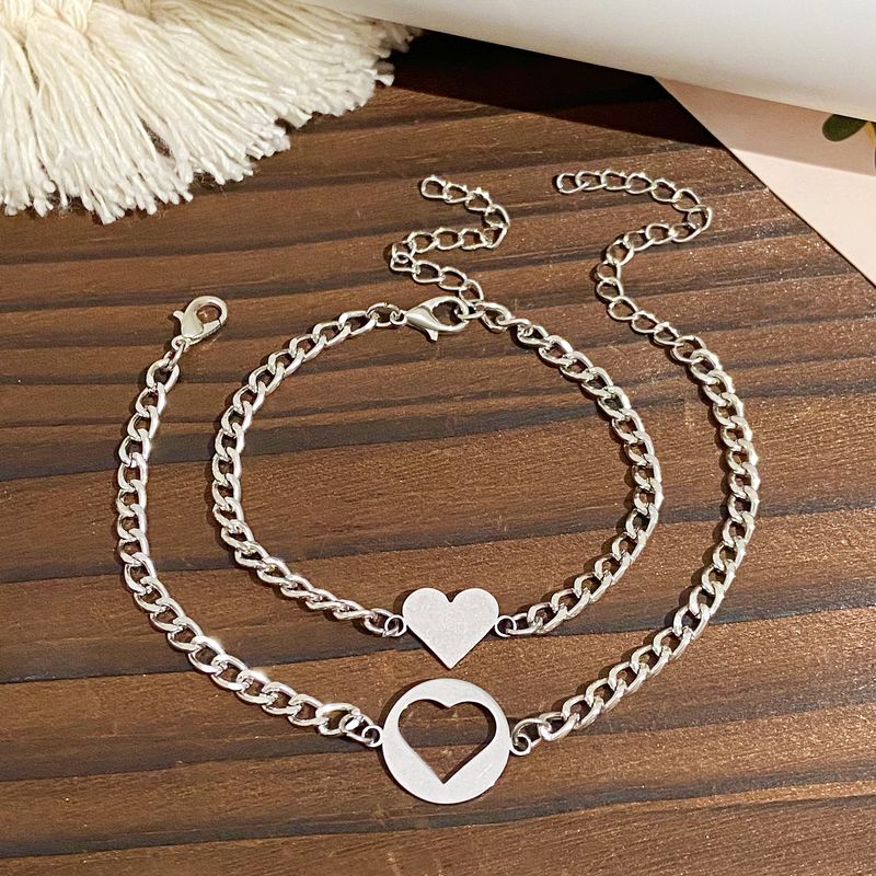 Set di 2 bracciali in acciaio inox con incisione, a forma di cuore cavo, sole e luna, in titanio_voghion.com