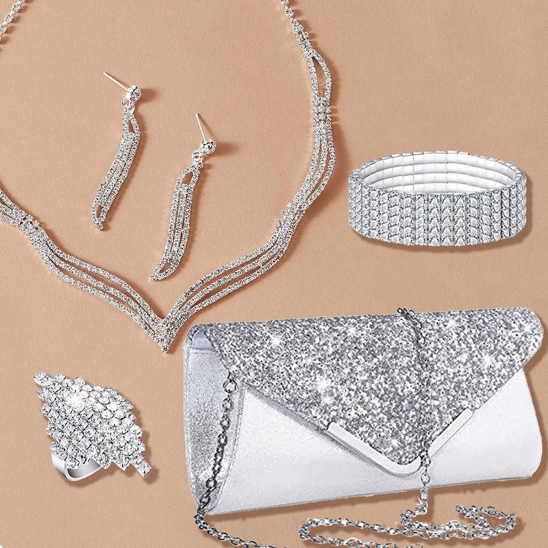 Set di gioielli da donna con collana di strass, orecchini, bracciale, anello e pochette per matrimoni, feste e serate, composto da cinque pezzi._voghion.com