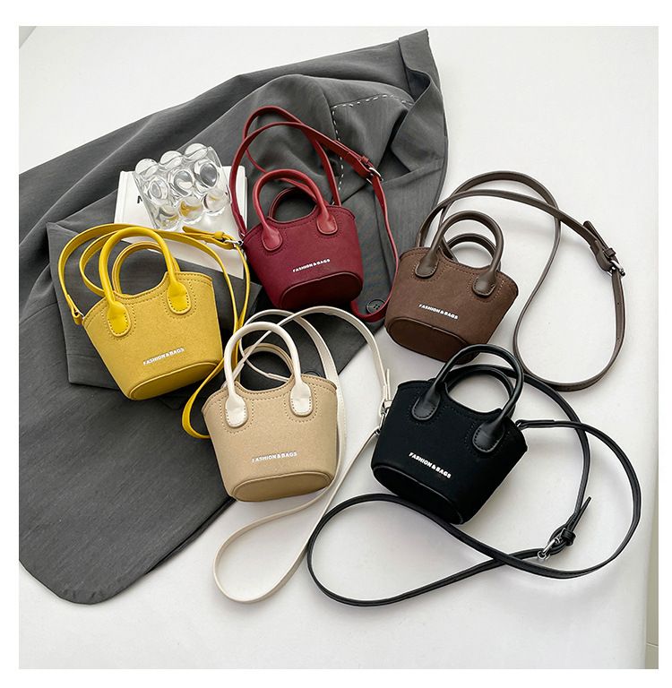 Borsa a secchiello da donna, alla moda, con tracolla monospalla, stile Candy Lover, con rossetto, da portare a spalla, rossa_voghion.com