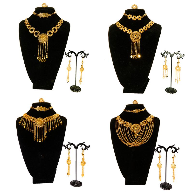 Set di quattro pezzi per collana, bracciale, orecchini e anello per sposa in oro nigeriano a Dubai_voghion.com