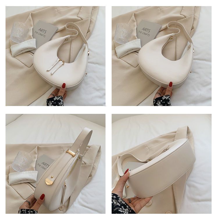 La nuova borsa di nicchia di quest'anno, borsa a mezzaluna a mezzaluna con spalla singola e ascellare di fascia alta da donna_voghion.com