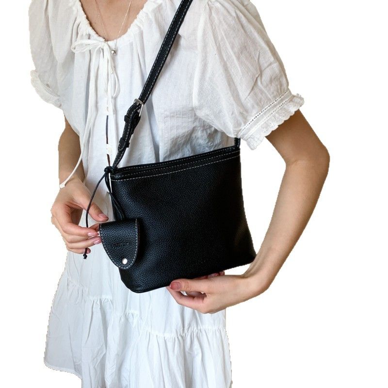 Borsa a secchiello semplice da portare a mano in stile coreano per le donne 2025, nuova nicchia versatile casual, trama litchi, spalla singola_voghion.com