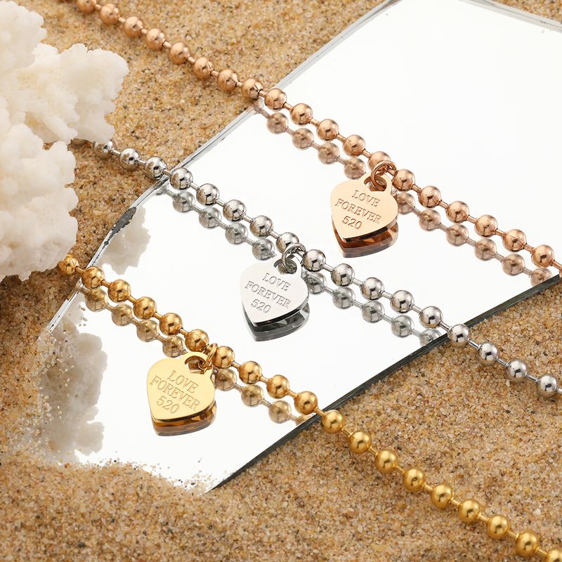 Nuovo ciondolo a forma di cuore, design di nicchia, catena con perline rotonde, bracciale da donna in acciaio al titanio con cuore di pesca._voghion.com