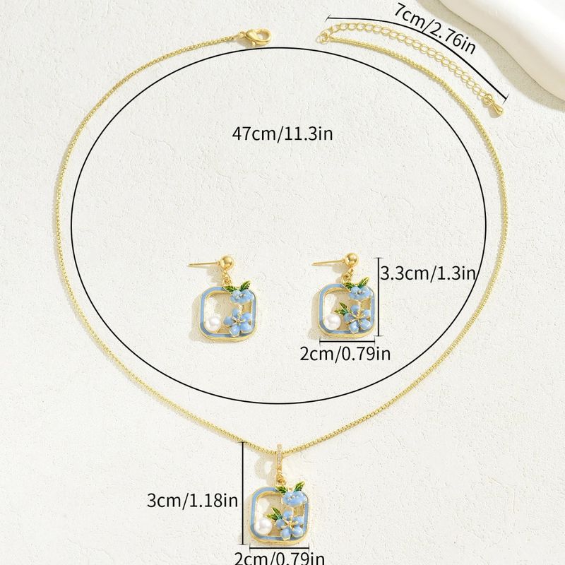 Set di collana e orecchini a forma di fiore per donna - Gioiello alla moda con intarsi a goccia d'olio e pendente dal design elegante_voghion.com