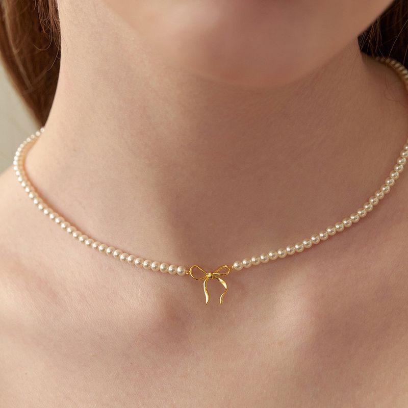 Damenschmuck, handgefertigt, Perlenkette mit Schleife, Fliege, geknoteter Anhänger, echt vergoldet, farbechte Halskette_voghion.com