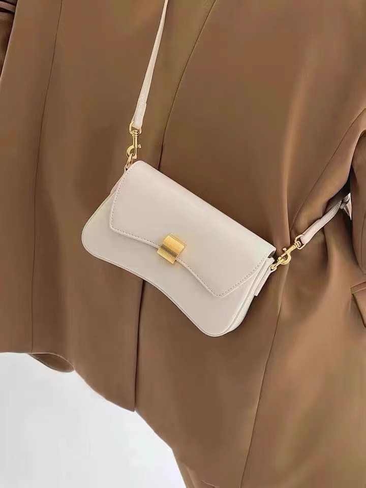 Französische Unterarmtasche 2023 Neues trendiges Nischendesign Leichte Luxus-Baguette-Tasche High-End-Sense-One-Shoulder-Messenger-Handtasche für Damen_voghion.com