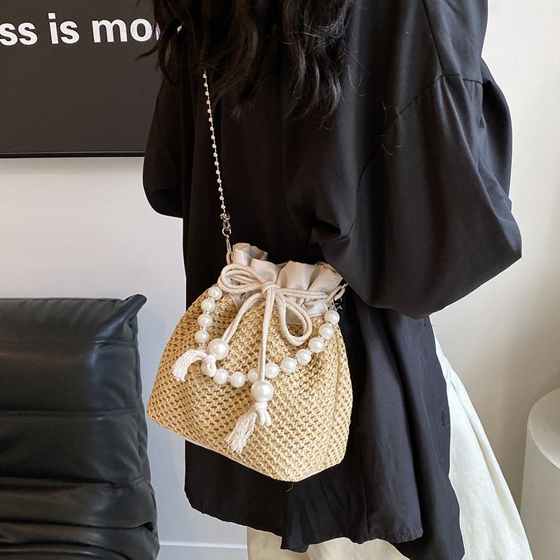 Sac bandoulière tendance en perles pour femme cette année, nouveau sac seau décontracté en paille tissée avec cordon de serrage_voghion.com