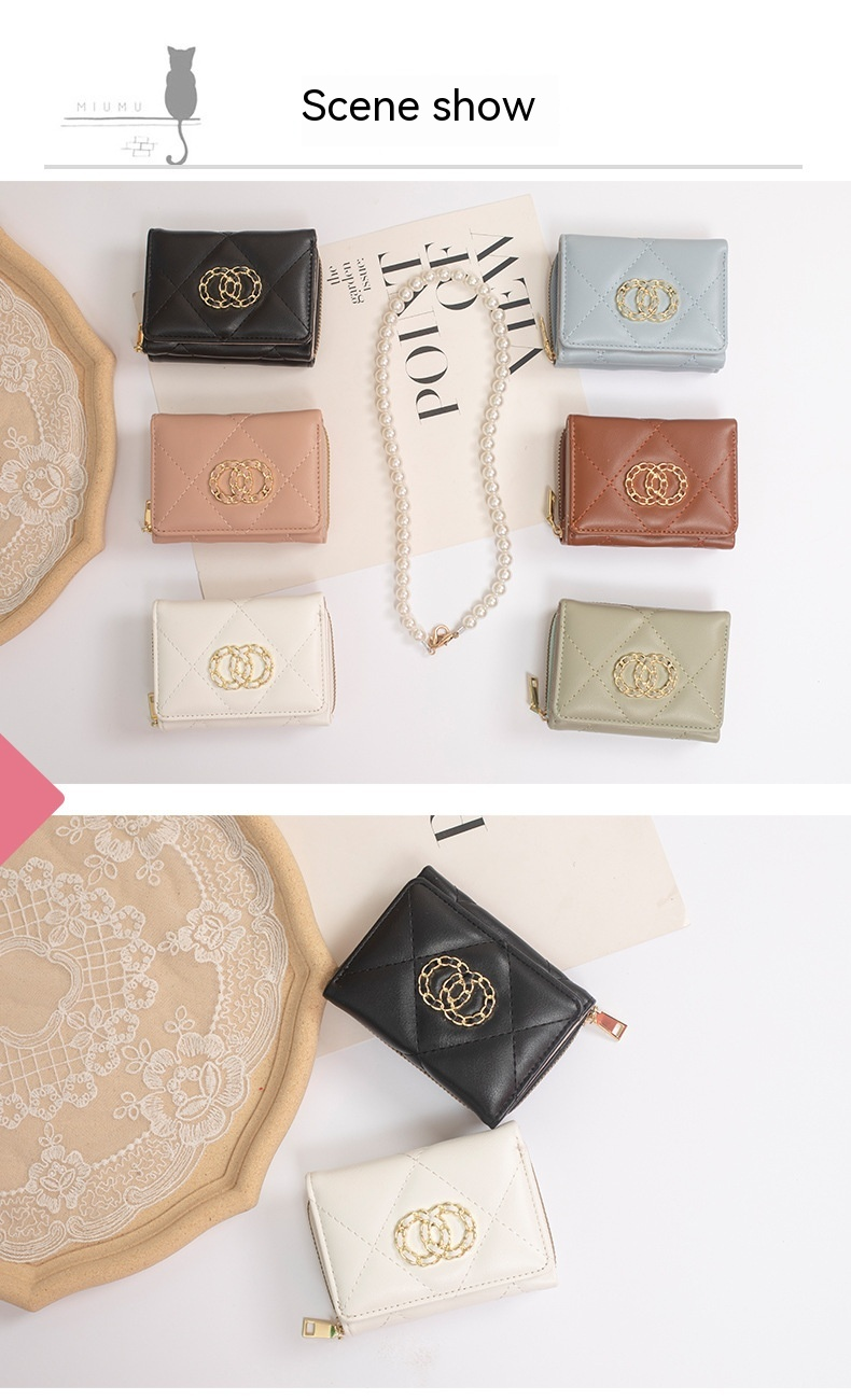 Portafoglio da donna Xiaoxiangfeng di vendita caldo Portafoglio corto a tre strati Ragazza Zero Portafoglio multi-carta Borsa con cerniera Borsa portatile Fermasoldi_voghion.com