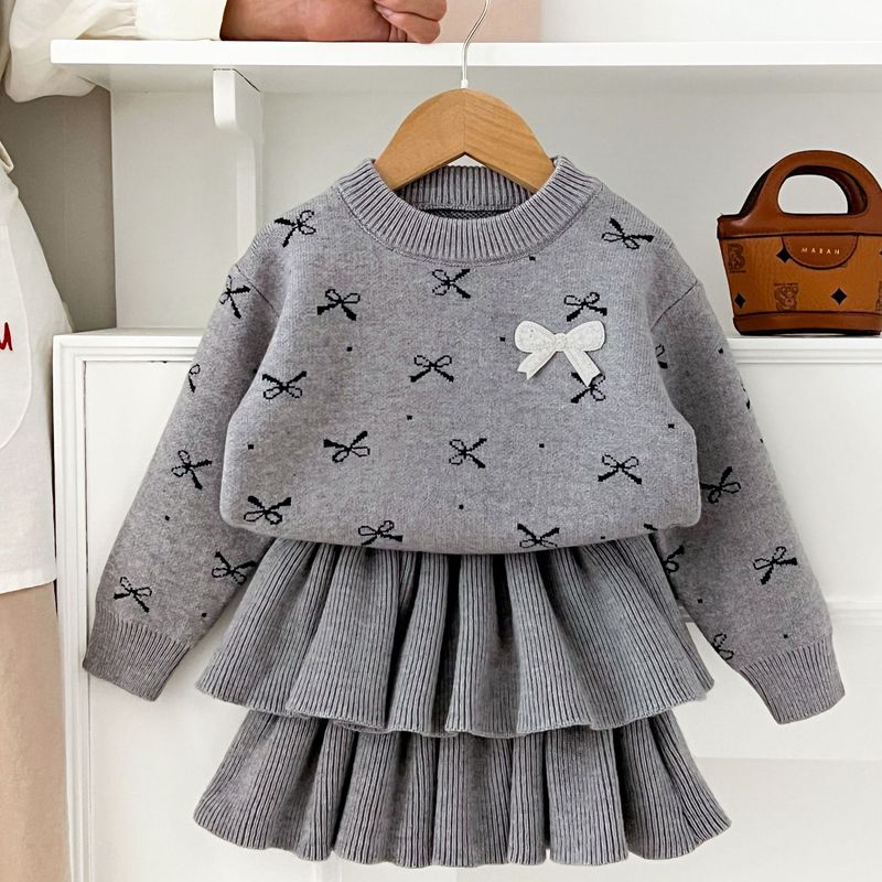 Gonna in maglia per ragazze 2025 Autunno e inverno, nuova gonna a torta con scollo rotondo e fiocco per ragazze, completo in due pezzi_voghion.com