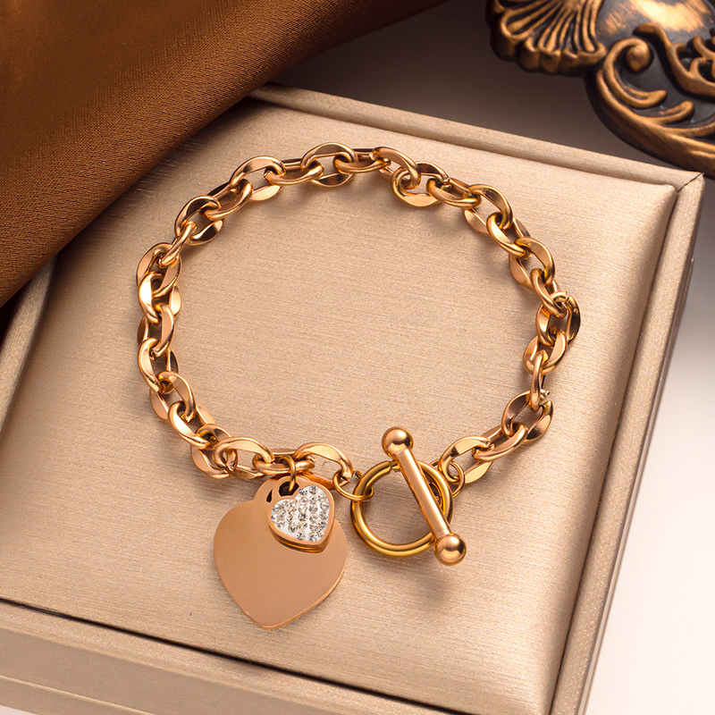 Semplice cuore di pesca Bracciale in acciaio al titanio con oro Anello con lettera Bracciale con fibbia a forma di T Bracciale in acciaio inossidabile a forma di cuore_voghion.com