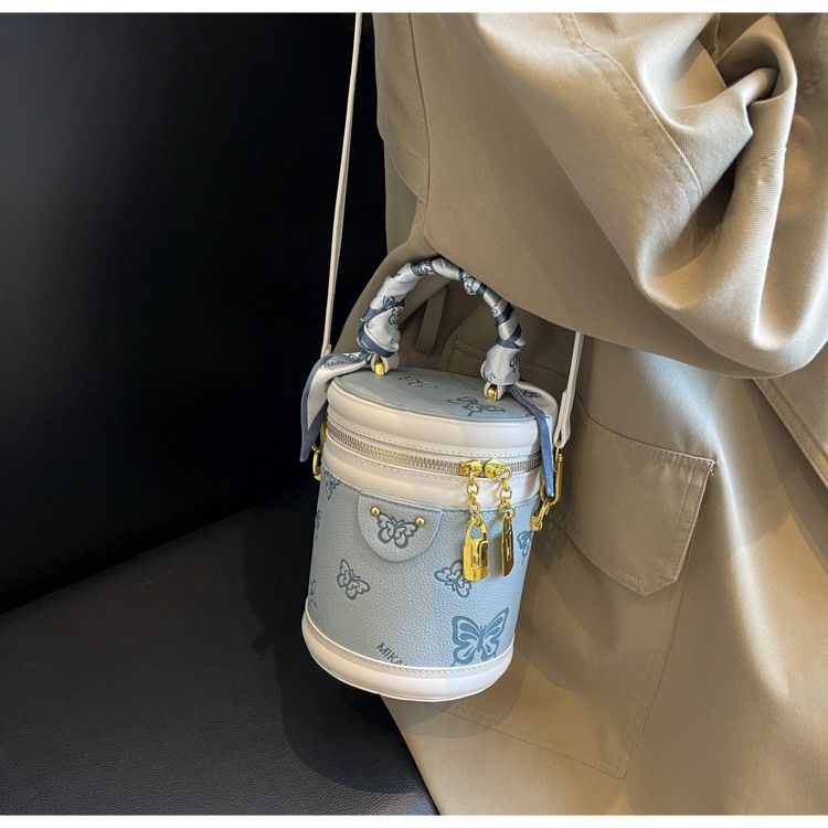 Borsa da donna retrò con motivo a farfalla, borsa a secchiello con colori a contrasto, borsa cilindrica da donna, borsa a tracolla con texture alla moda, design di nicchia_voghion.com