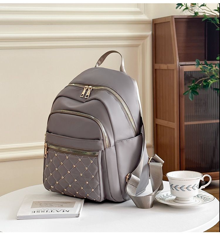 Spring summer Oxford grid patterned backpack with fashionable rivets for outdoor travel and commuting_voghion.com