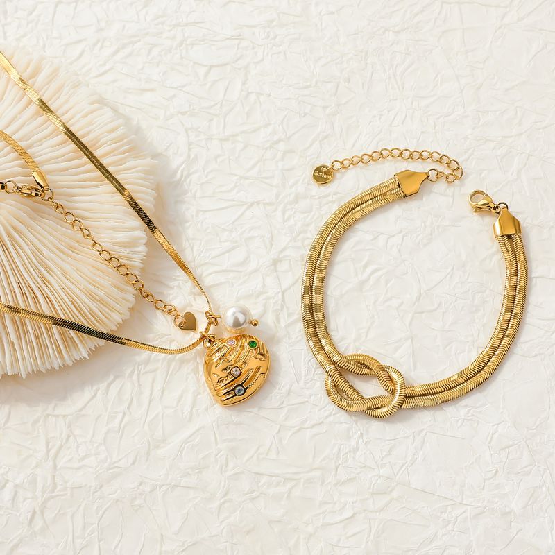 Bracciale da donna in acciaio al titanio con osso di serpente appiattito, collana in conchiglia dorata, placcato elettroliticamente e intarsiato con zirconi a quattro colori, set di braccialetti personalizzati_voghion.com