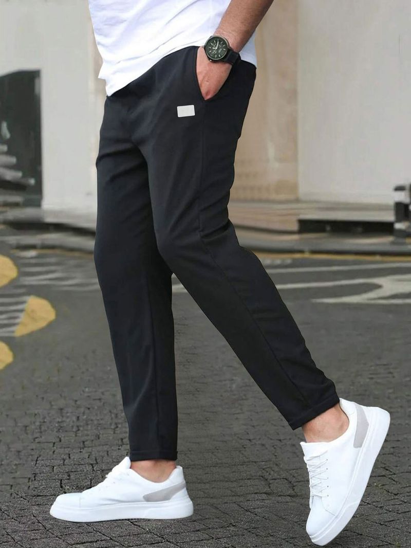 Pantaloni casual slim fit da uomo - Tinta unita, design a nove punti, dettaglio etichetta in pelle, comodi pantaloni con tasche_voghion.com