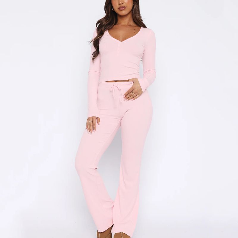 Completo due pezzi da donna, modello primavera autunno 2024, con maniche abbottonate, tinta unita, top attillato e pantaloni lunghi_voghion.com