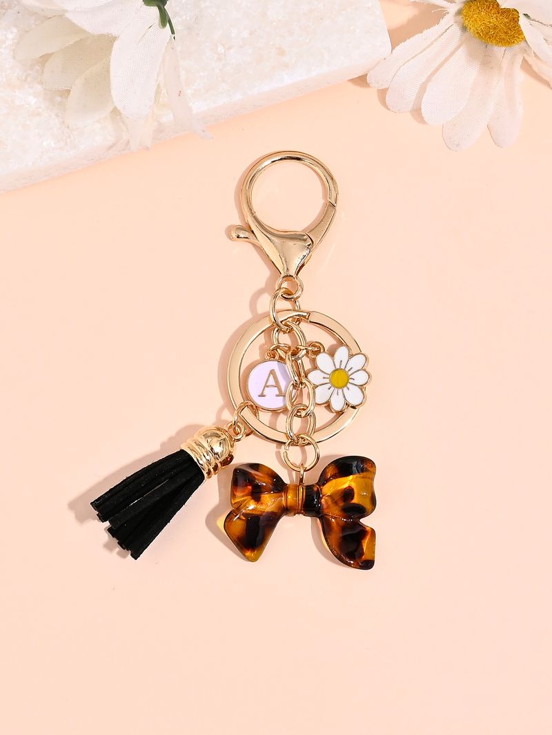 Porte-clés avec pompon et nœud papillon imprimé léopard, nouvelle mode, mignon, pendentif pour sac_voghion.com