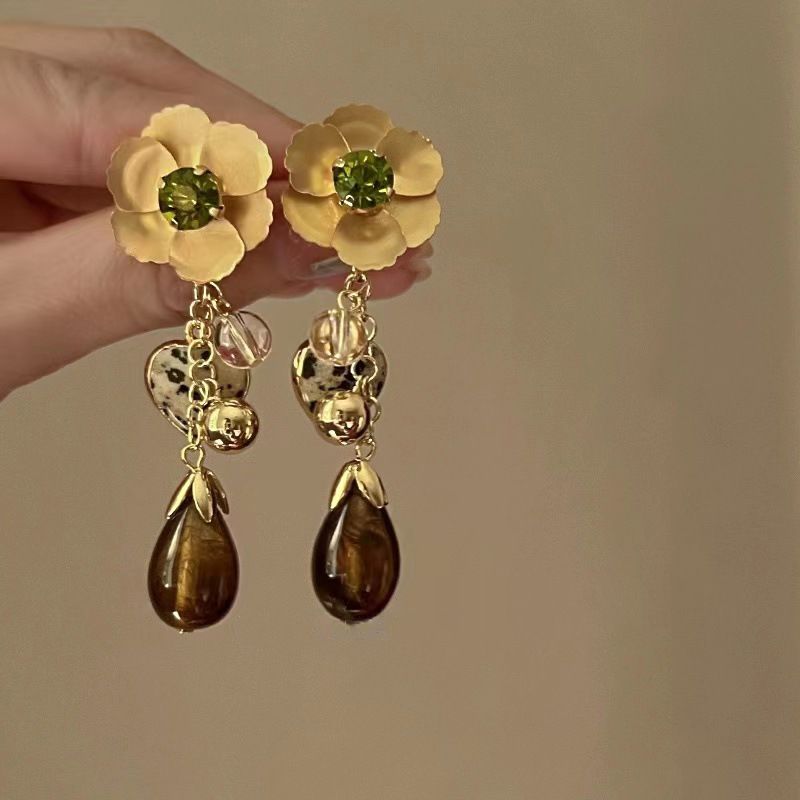 Nappa con fiore scavato con ago d'argento, alla moda, personalizzata, stile fresco e distaccato, lunga, elegante e di alta qualità._voghion.com