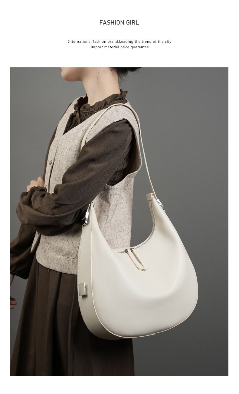 Borsa a tracolla da donna in vera pelle di vacchetta, modello a mezzaluna, con design primaverile ed estivo._voghion.com