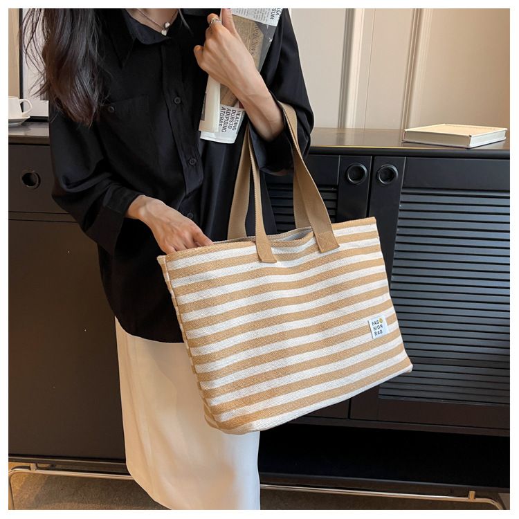2024 New Spring/summer Popular Simple Shoulder Bag Commuter Handheld Canvas Tote Bag Casual Large Capacity Bag for Women_voghion.com