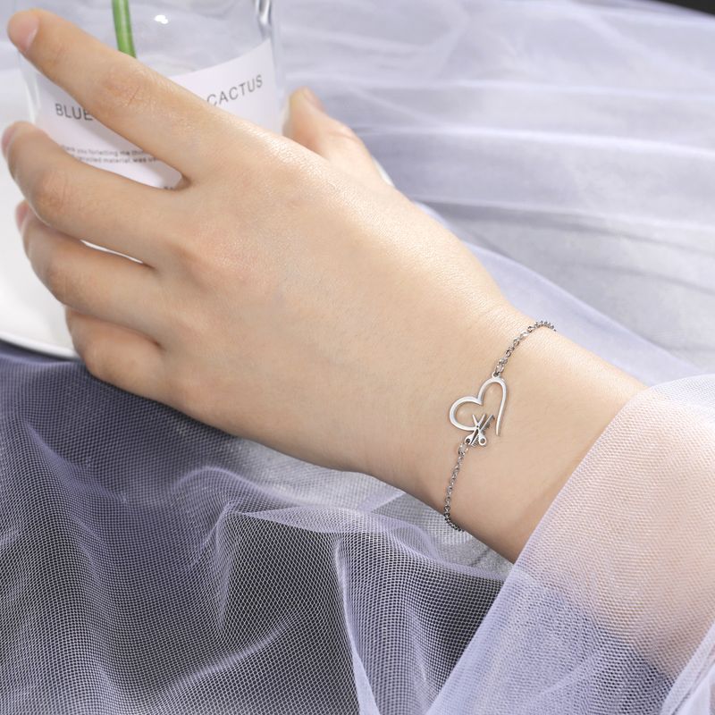 Stainless steel bracelet creative design sense of love hair tool pendant bracelet jewelry_voghion.com