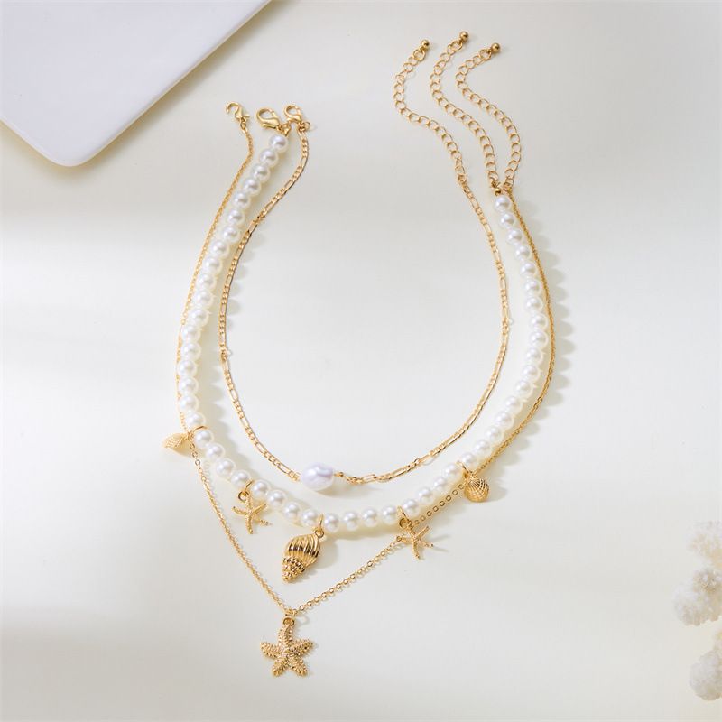 Ensemble de bijoux pour femme : collier multicouche en coquillage, perle et conque, style rétro estival, avec pendentif étoile de mer._voghion.com
