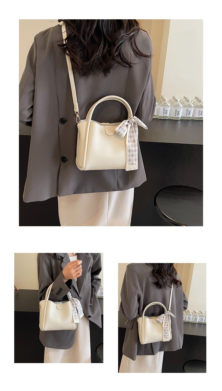 Nuova borsa da viaggio a mano 2024 per le donne, con un senso di lusso, semplicità, tendenza e una borsa a tracolla versatile in stile coreano, una popolare borsa a secchiello_voghion.com