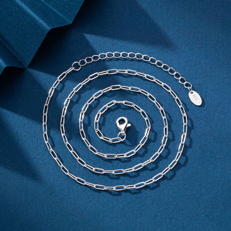 Collana da donna minimalista in argento Sterling S925 con ciondolo a croce geometrica, catena per l'eleganza quotidiana, catena per clavicola con croce a forma di fiore cubico_voghion.com