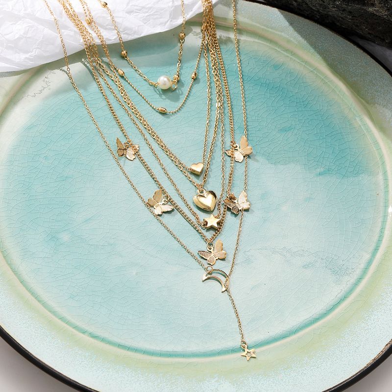 Hot selling alloy set, creative and personalized multi-layer butterfly pendant, 6 pieces of moon peach heart necklace_voghion.com