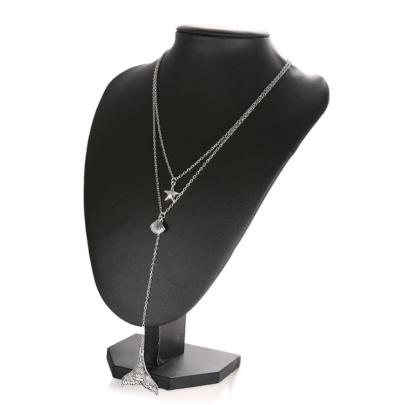 Gioielli di tendenza, stelle marine, capesante, coda di pesce, collana multistrato, catena corta per clavicola_voghion.com