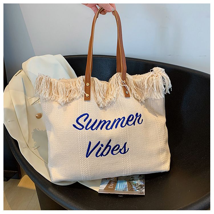 Beach canvas shoulder women's large tassel bag, lightweight embroidered underarm bag_voghion.com