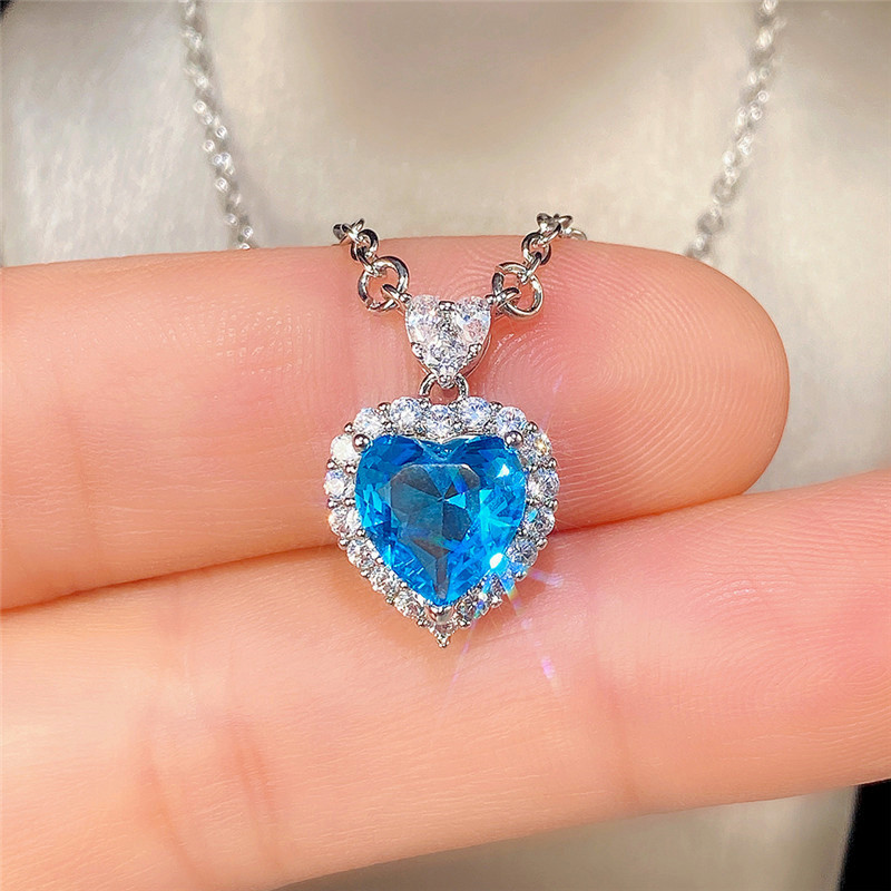 Conjunto de pendientes y anillo con colgante de corazón de océano con circonita azul topacio de nueva tendencia de Cao Shi Live para mujer_voghion.com
