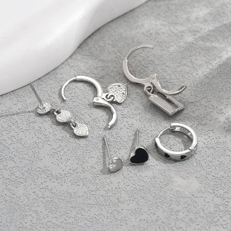 Boucles d'oreilles pour femmes de style universitaire minimaliste noir avec un design d'amour de niche et d'huile dégoulinante, boucles d'oreilles haut de gamme, boucles d'oreilles polyvalentes_voghion.com