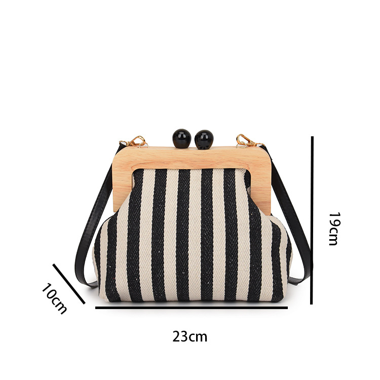2024 Borsa da donna nuova Borsa a tracolla in tela con clip in legno a righe Borsa a tracolla con una spalla alla moda e raffinata_voghion.com