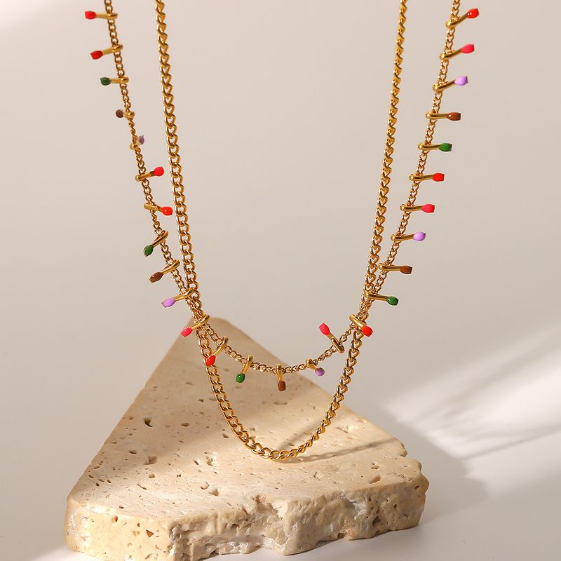 Collana in titanio francese INS nuova placcata in oro con catena cubana a doppio strato in acciaio inossidabile con nappa smaltata e affascinante collana_voghion.com