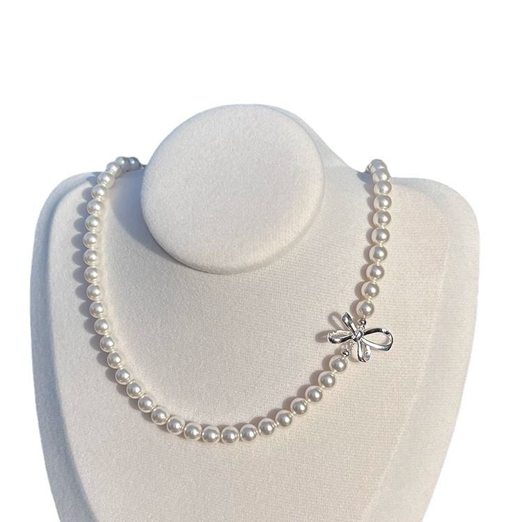 Collana di perle di lusso in argento puro con fiocco in nastro di nicchia, per donna, versatile e di alta qualità, con catena per clavicola._voghion.com